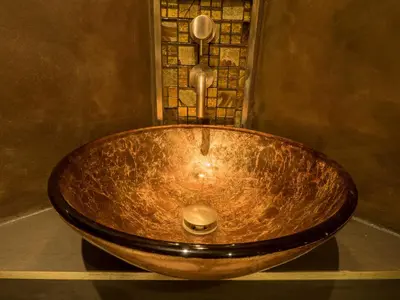 a wooden bath tub sitting in a bathroom at Chy Glynn. Luxury lodge with hot tub and views. in St. Agnes