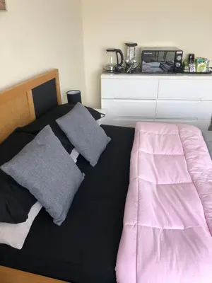 a bed with two pillows on it in a room at All March 70 pounds per night with 3 nights minimum stay in St Austell