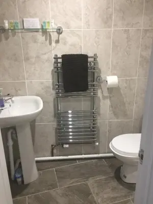 a bathroom with a sink and a toilet at All March 70 pounds per night with 3 nights minimum stay in St Austell