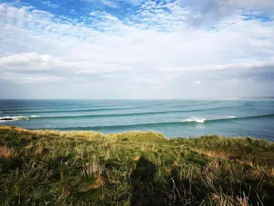 a view of the ocean from the bluff of a beach at 7 Ocean Gate in Newquay