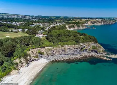 an aerial view of a beach and the ocean at Sandy cottage, nr Eden & beaches in St Austell