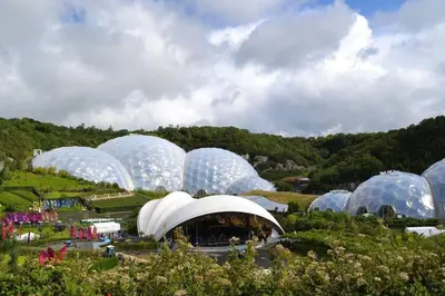 a bunch of domes in a field with people in them at Sandy cottage, nr Eden & beaches in St Austell