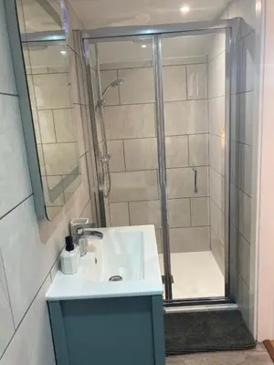 a bathroom with a sink and a shower at Laity's Lodge in Penzance