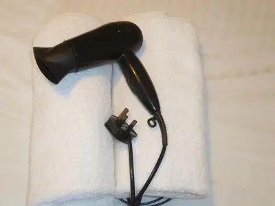 a blow dryer sitting on top of a towel at Grey Mullet Guest House in St Ives