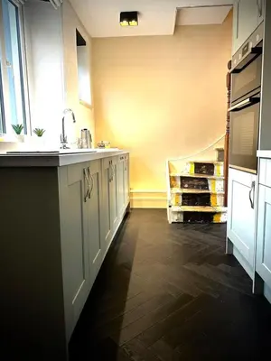 a kitchen with a sink and a counter at Waterside Victorian house at Golant Fowey in Fowey