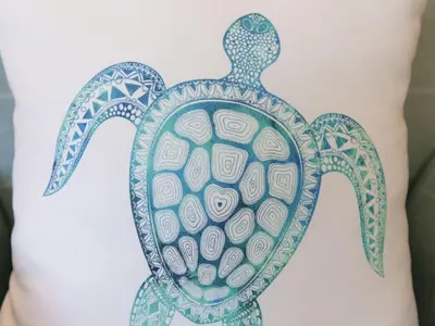 a drawing of a turtle on the back of a woman at Atlantis in St Ives