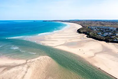 an aerial view of a beach with the ocean at Family friendly home by the beach in Hayle