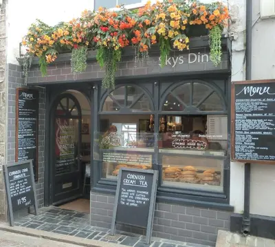 a donut shop with a display case in front of it at Grey Mullet Guest House in St Ives