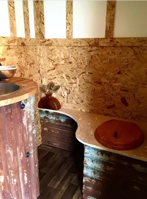 a bathroom with a wooden sink and a counter at Field Hut in Wadebridge