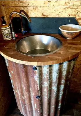 a stainless steel sink in a wooden counter top at Field Hut in Wadebridge