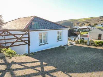 a white house with a gate and a driveway at Salakee in Penzance