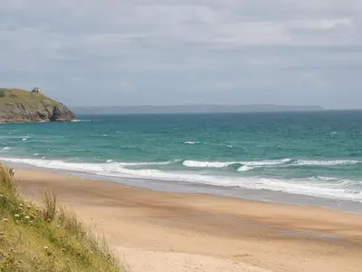 a sandy beach with the ocean in the background at Salakee in Penzance