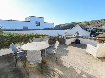 a table and chairs on the patio of a house at Salakee in Penzance