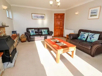 a living room with couches and a coffee table at Salakee in Penzance