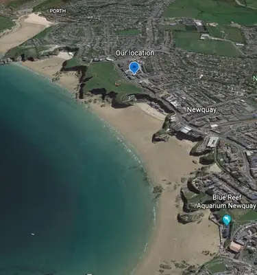 a map of a beach next to the water at Luxury 3 floor Town House by Tolcarne Beach in Newquay