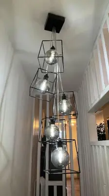 a cluster of lights hanging from a ceiling at The Lounge in Newquay