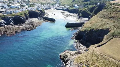 an aerial view of a beach next to the ocean at Seascape Hideaways at Port Isaac in Port Isaac