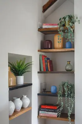 a room with shelves with vases and books at Seascape Hideaways at Port Isaac in Port Isaac