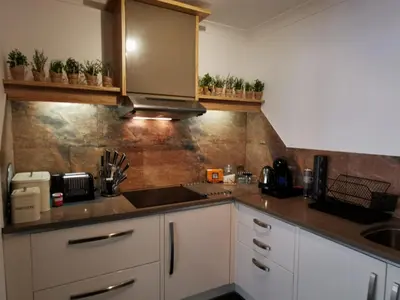 a kitchen with a sink and a counter top at Sandsifter at 4 Trencrom Court, Carbis Bay,St Ives, Cornwall in Carbis Bay