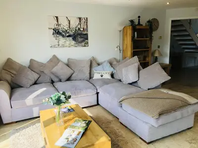 a living room with a couch and a coffee table at Trewhiddle Retreat V29 by Together Travel - Luxury 4-Bedroom Villa in St Austell