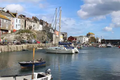 a group of boats docked in a harbor with buildings at Trewhiddle Retreat V23 by Together Travel - Luxury 4-Bedroom Villa in St Austell