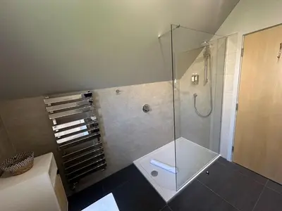 a bathroom with a shower with a glass shower stall at Trewhiddle Retreat V14 by Together Travel - Luxury 4-Bedroom Villa in St Austell