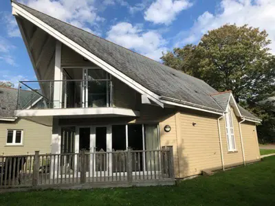 a house with a gambrel roof at Trewhiddle Retreat V19 by Together Travel - Luxury 4-Bedroom Villa in St Austell