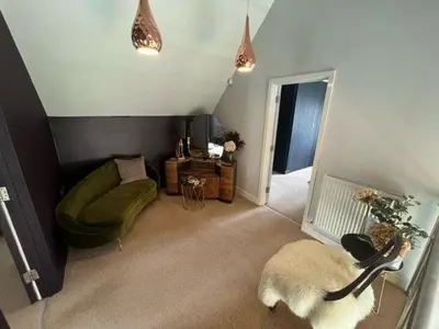 a living room with a dog laying on the floor at Trewhiddle Retreat V5 by Together Travel - Luxury 4-Bedroom Villa in St Austell