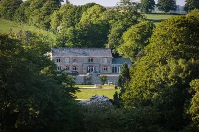 a large house in the middle of a forest at Trewhiddle 41 by Together Travel - Stylish Coastal Countryside Retreat in St Austell