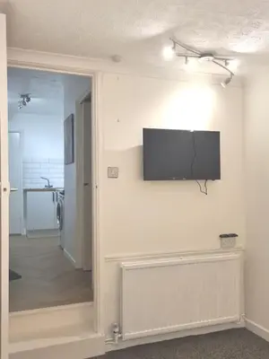 a room with a flat screen tv on a wall at Cosy Self Contained Annexe in Bodmin
