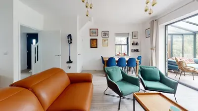 a living room with a couch and chairs at 05 Queensway Gardens, Hayle in Hayle