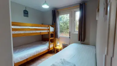 two bunk beds in a room with a window at 34 Trevithick Court, Tolroy Manor in Hayle