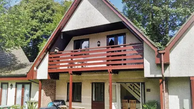 a house with a balcony on top of it at 34 Trevithick Court, Tolroy Manor in Hayle