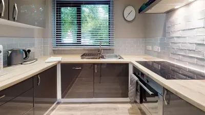 a kitchen with a sink and a counter top at 48 Trevithick Court, Tolroy Manor in Hayle