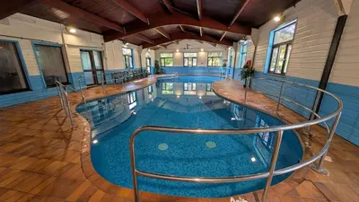 a large swimming pool in a building at 01 Tudor Court, Tolroy Manor in Hayle