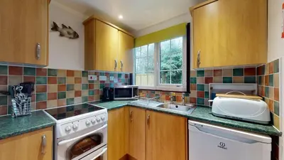 a kitchen with a sink and a dishwasher at 01 Tudor Court, Tolroy Manor in Hayle