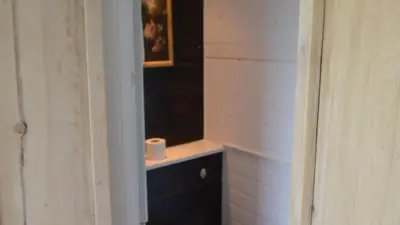 a roll of toilet paper sitting on a shelf in a room at D04 Hawaiian D4, Riviere Towans in Hayle