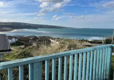a view of the ocean from a balcony at D39 St Margarets, Riviere Towans in Hayle