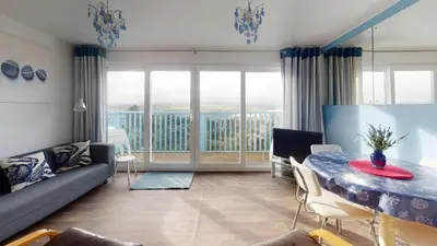 a living room with a couch and a table at D39 St Margarets, Riviere Towans in Hayle