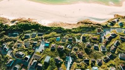 an aerial view of the beach and houses at C17 Sandyridge, Riviere Towans in Hayle