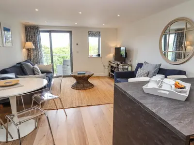 a living room with a couch and a table at Bamaluz in Carbis Bay