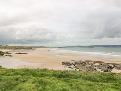 a view of a beach with the ocean at Cinders Loft in Redruth