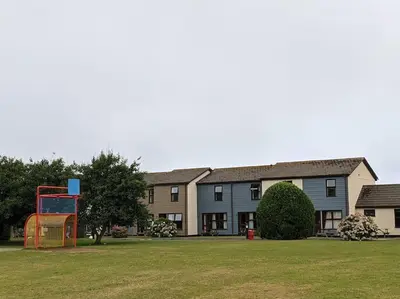 a large building with a playground in front of it at No.7 Perran View in St. Agnes