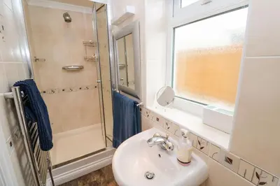 a bathroom with a sink and a shower at Rosemount in Marazion