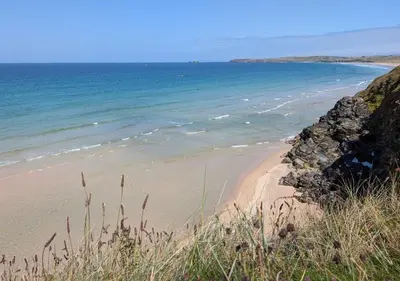 a sandy beach with the ocean in the background at D56 Beachcomber, Riviere Towans in Hayle