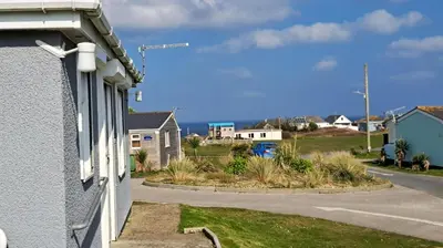 a view of a street from a house at E14 Sea Haven, Riviere Towans in Hayle