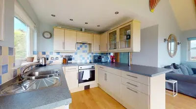 a kitchen with a sink and a counter top at E46 Dunroven, Riviere Towans in Hayle