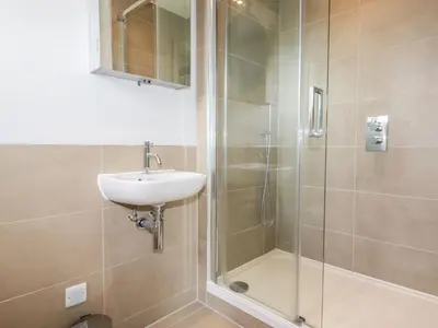a bathroom with a shower and a sink and a shower at Lavender House in Newquay
