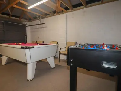 two pool tables in a room with chairs at Lavender House in Newquay