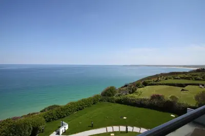 an aerial view of a golf course and the ocean at Glas Mor in Carbis Bay